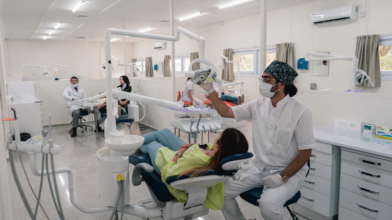A dentist examining a patient in a bright dental clinic